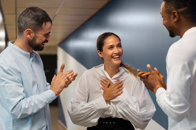 Free Photo person expressing appreciation to their workmates