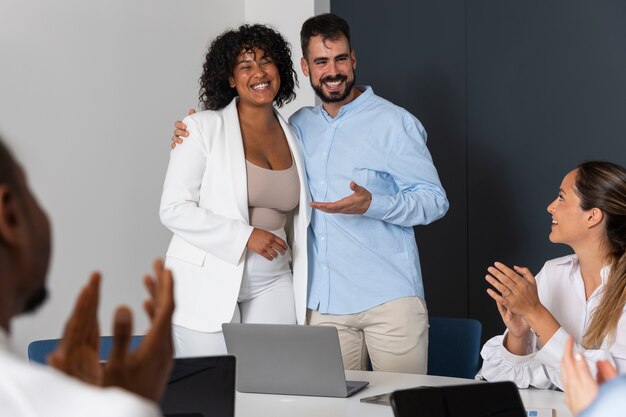 Person expressing appreciation to their workmates