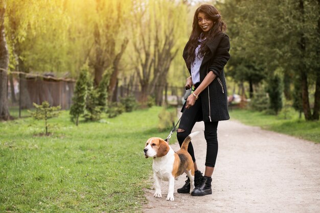 person female walk african dog