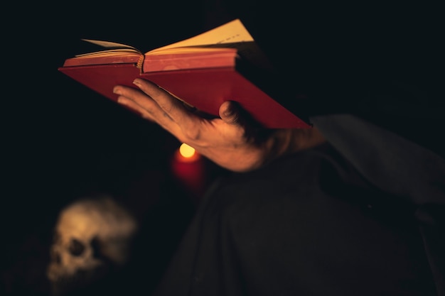 Person gestures of holding a red book