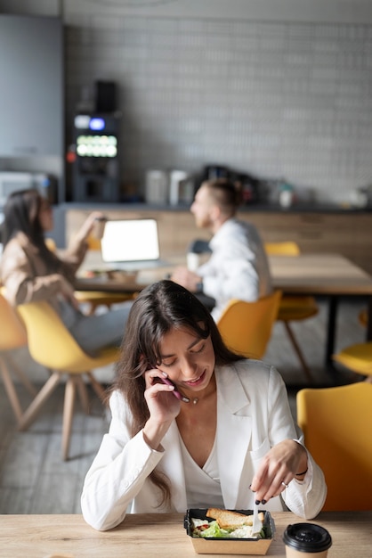 Free photo person getting break time at office