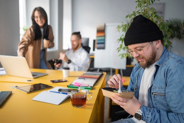 Free photo person getting break time at office