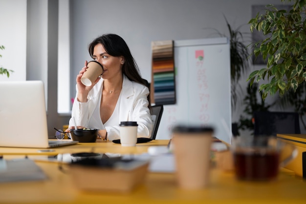 Free photo person getting break time at office