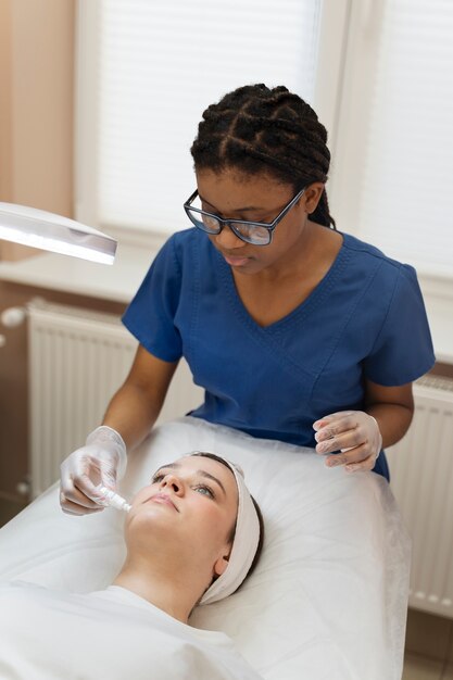 Person getting micro needling beauty treatment