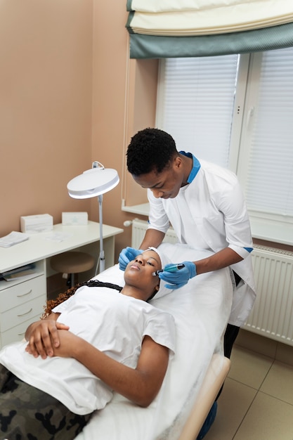 Person getting micro needling beauty treatment