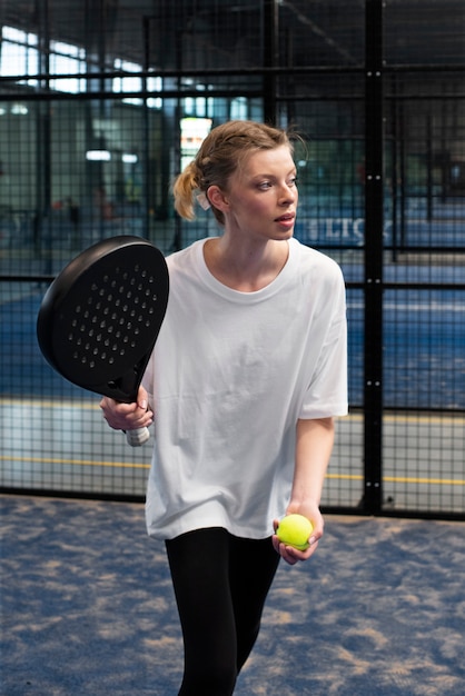 Free Photo person getting ready to play paddle tennis inside