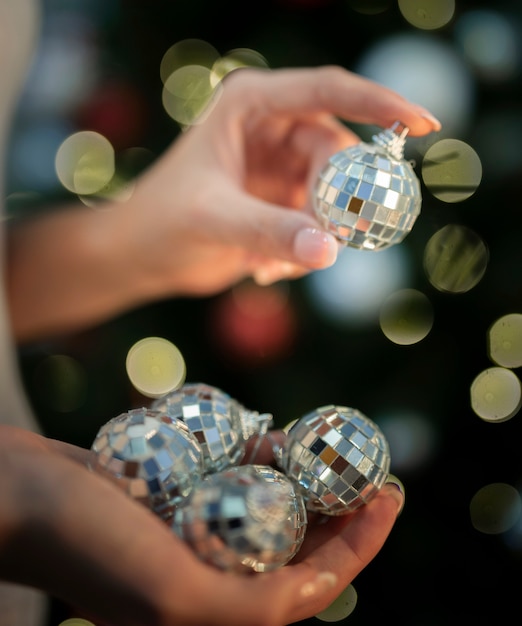 Free photo person holding a christmas toys