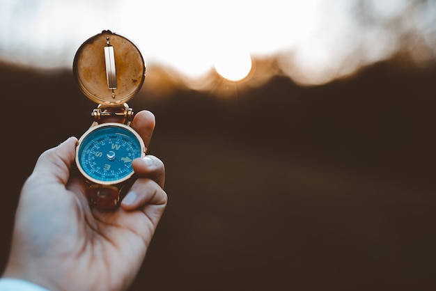 Person holding a compass