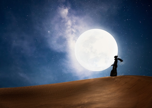 Free Photo person holding moon