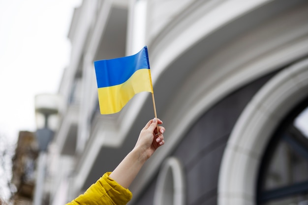 Person holding ukrainian flag