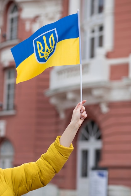 Person holding ukrainian flag