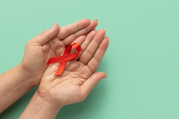 Free photo person holding an world aids day ribbon