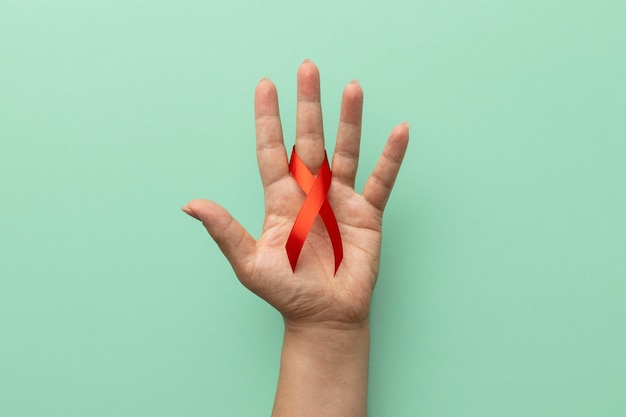 Free photo person holding an world aids day ribbon