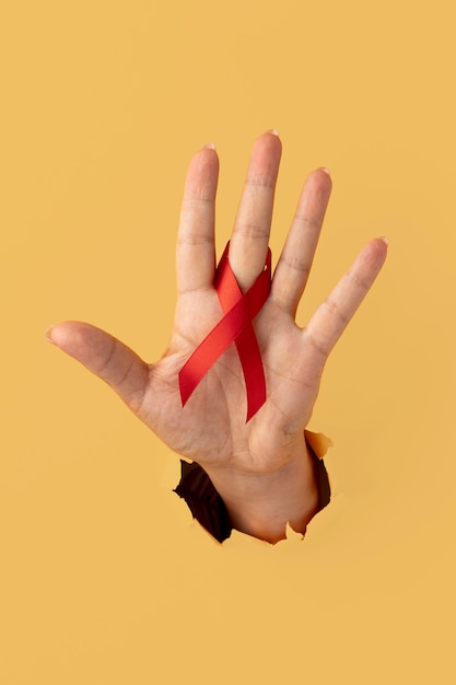 Free photo person holding an world aids day ribbon