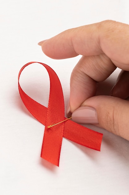 Free photo person holding an world aids day ribbon