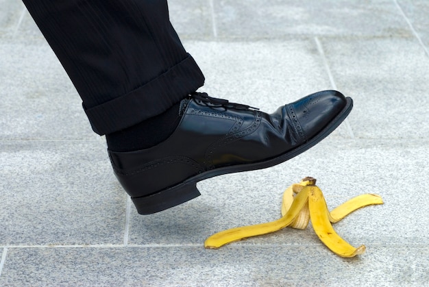 Free Photo a person is going to step on a banana peel