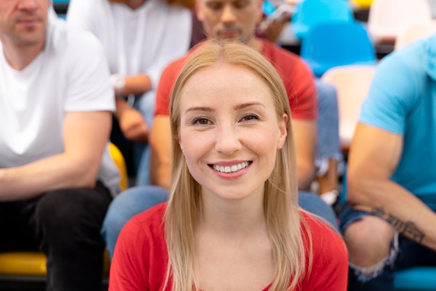 Person looking at a football game in a sunny day