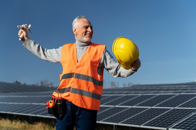 Free photo person near alternative energy plant