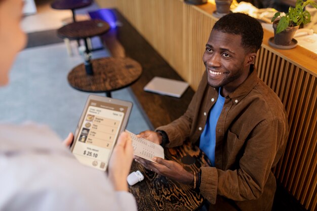 Person ordering food at restaurant