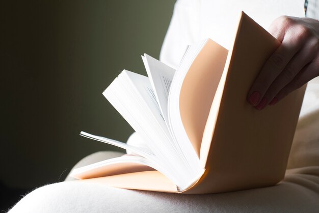 Person passing the pages of a book