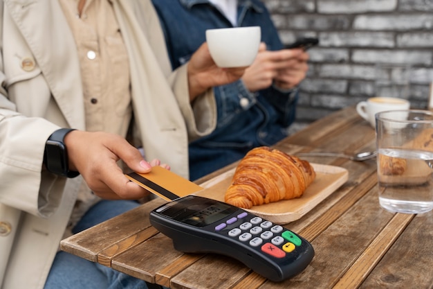 Person paying using nfc technology