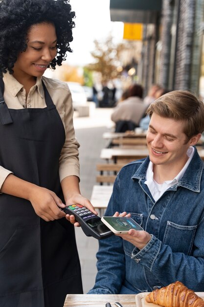 Person paying using nfc technology