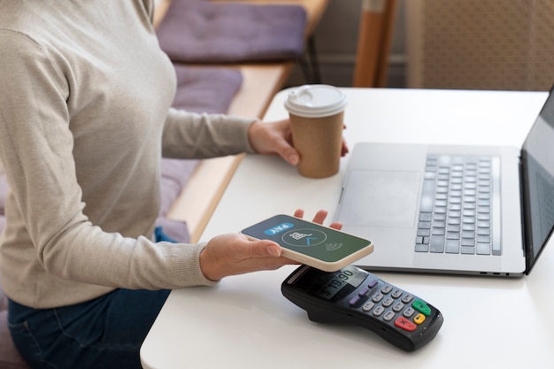 Person paying using nfc technology