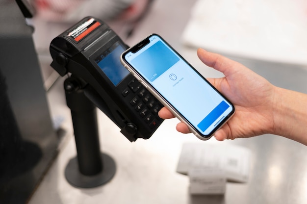 Person paying with its smartphone wallet app