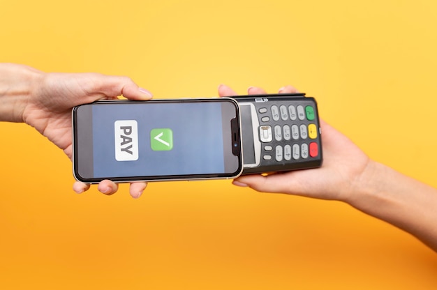 Person paying with its smartphone wallet app