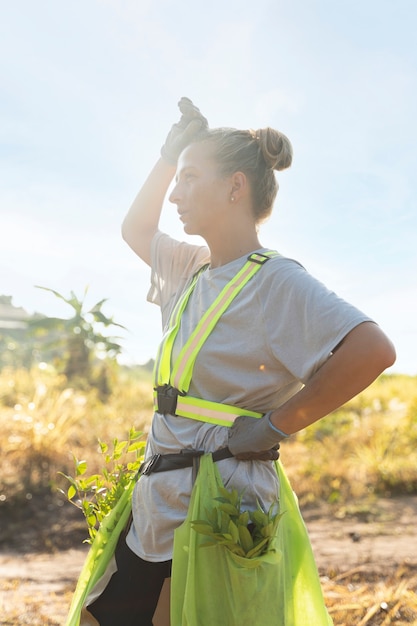 Person planting tree on the countryside