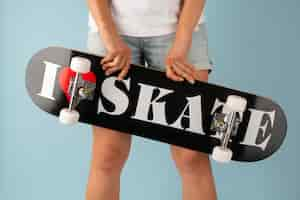 Free photo person posing with skateboard