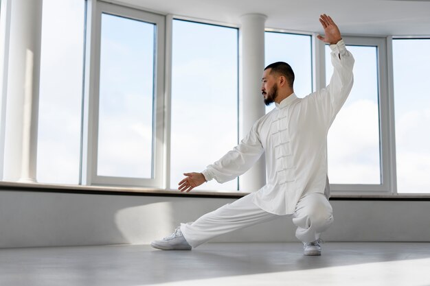 Person practicing tai chi indoors