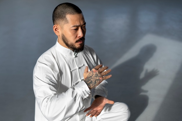 Person practicing tai chi indoors