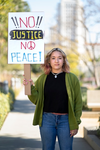 Free photo person protesting with placard for world environment day outdoors