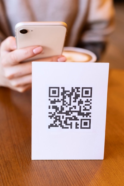 Free Photo person scanning qr code