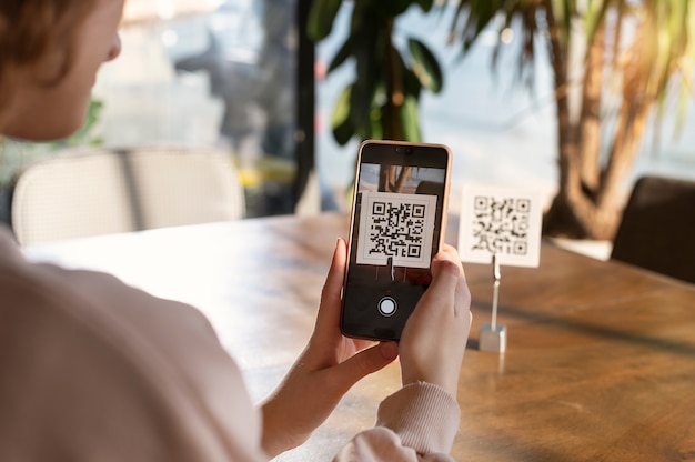 Free Photo person scanning qr code