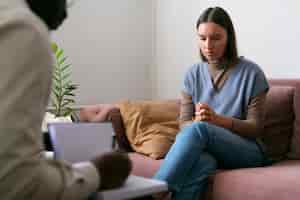 Free photo person sharing feelings and emotions during therapy session