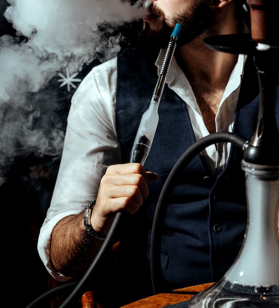 A person smoking hookah