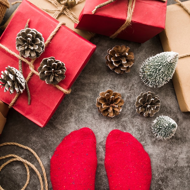 Person standing on floor with gift boxes