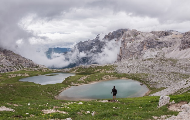 Person standing near body of water