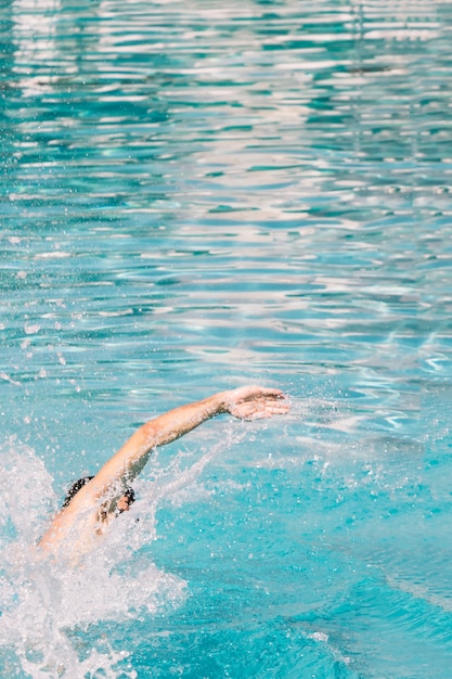 Free photo person swimming in pool