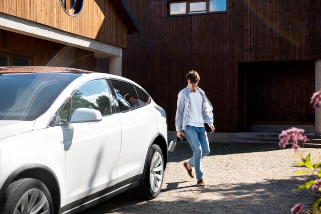 Person taking care of electric car