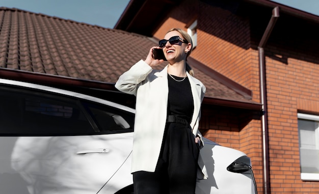 Free photo person taking care of electric car