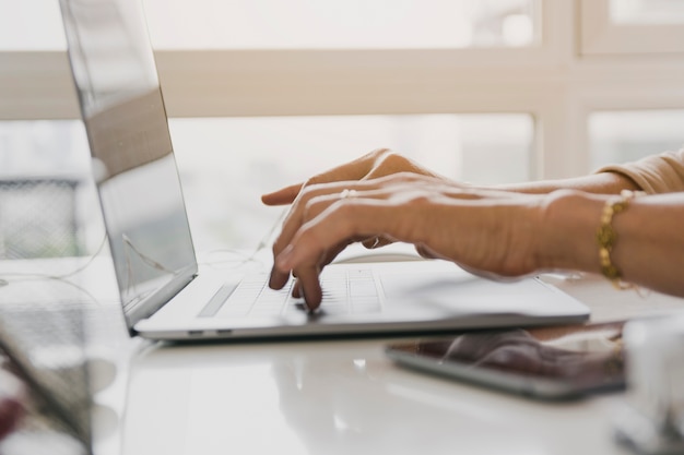 Person typing on modern laptop