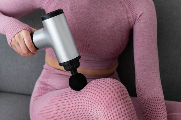 Free Photo person using massage gun