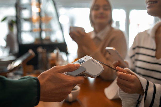 Free Photo person using nfc technology to pay at a restaurant