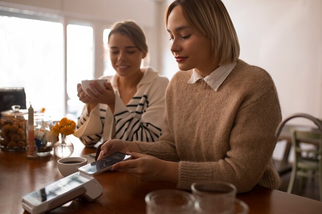 Person using nfc technology to pay at a restaurant