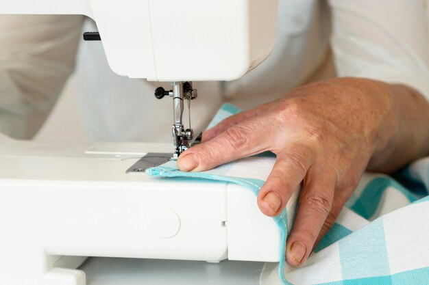 Person using sewing machine