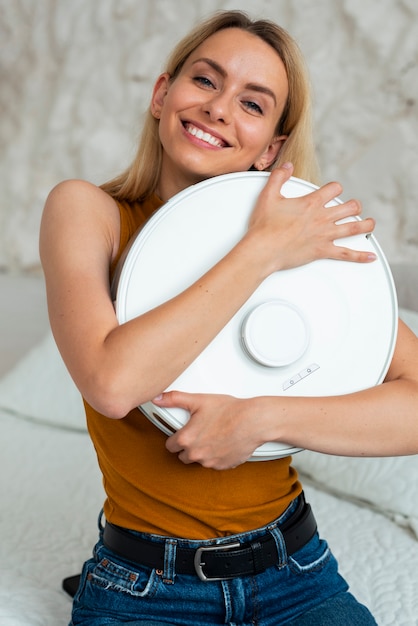 Free photo person using vacuum cleaner at home