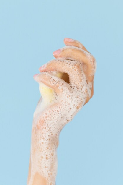 Person washing hands with soap